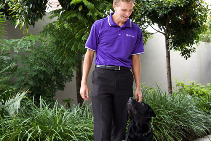Gerrard Gosens with Guide Dog Boss at MAX Solutions National Support Centre, QLD. 