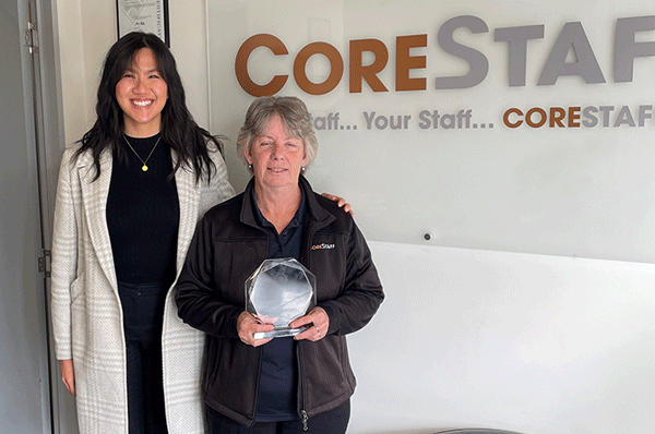 Claudia Choe (MAX) and Annette Cusick (CoreStaff Hobart) smile at the camera, Annette holding the award